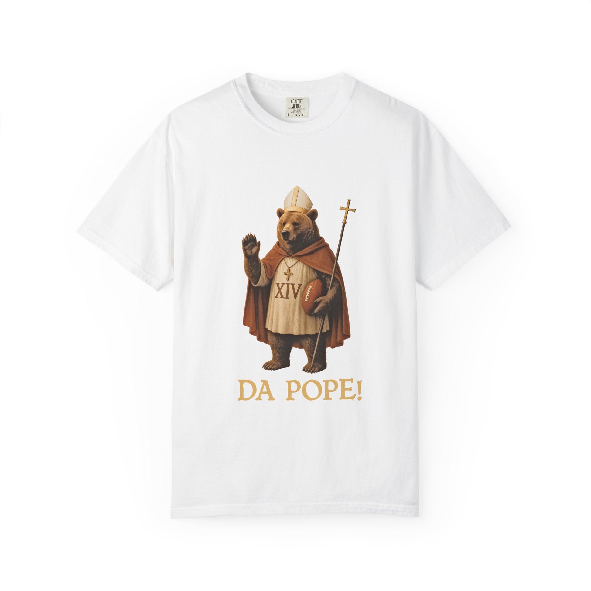 The front side of a white colored t shirt with a design of a Bear dressed as the pope with the saying DA POPE! below.