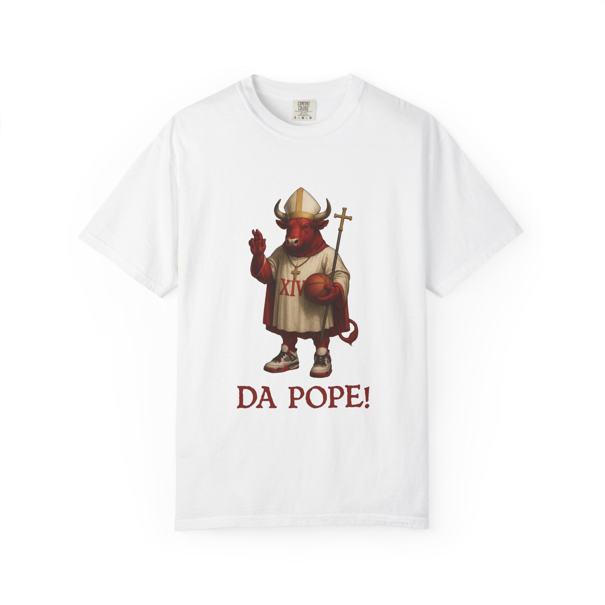 The front side of a white colored t shirt with a design of a red Bull dressed as the pope with the saying DA POPE! below.