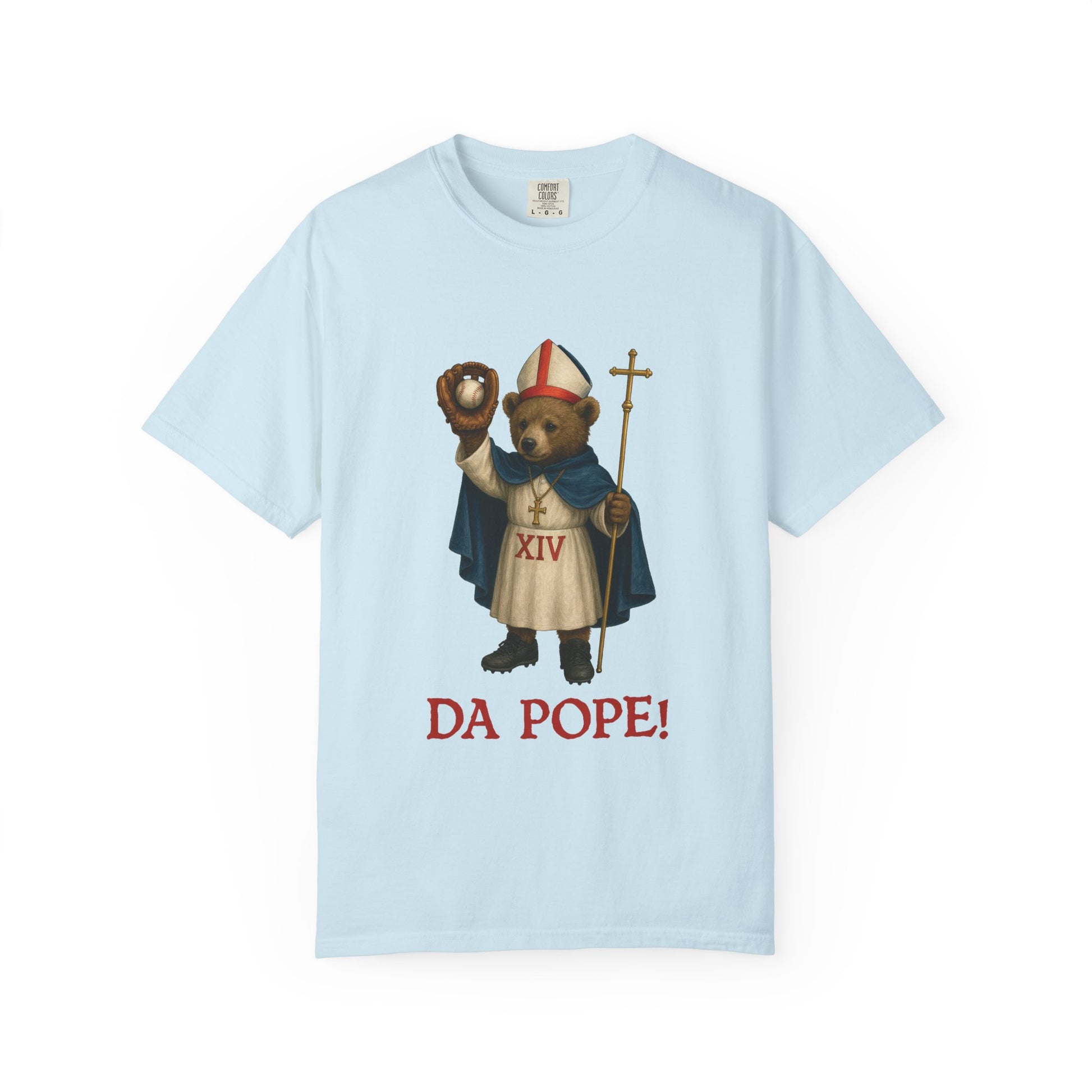 The front side of a light blue colored  t shirt with a design of bear cub dressed as the pope with the saying below saying  DA POPE!